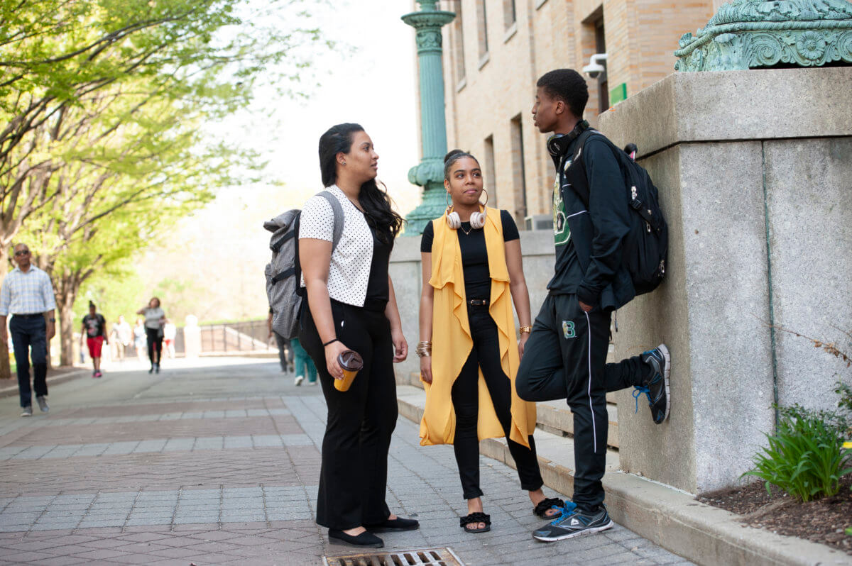 Bronx Community College students outdoors on campus.